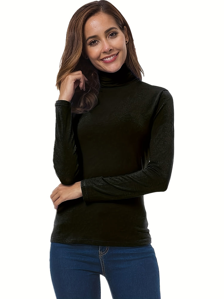 Woman wearing a black turtleneck sweater and blue jeans on a white background